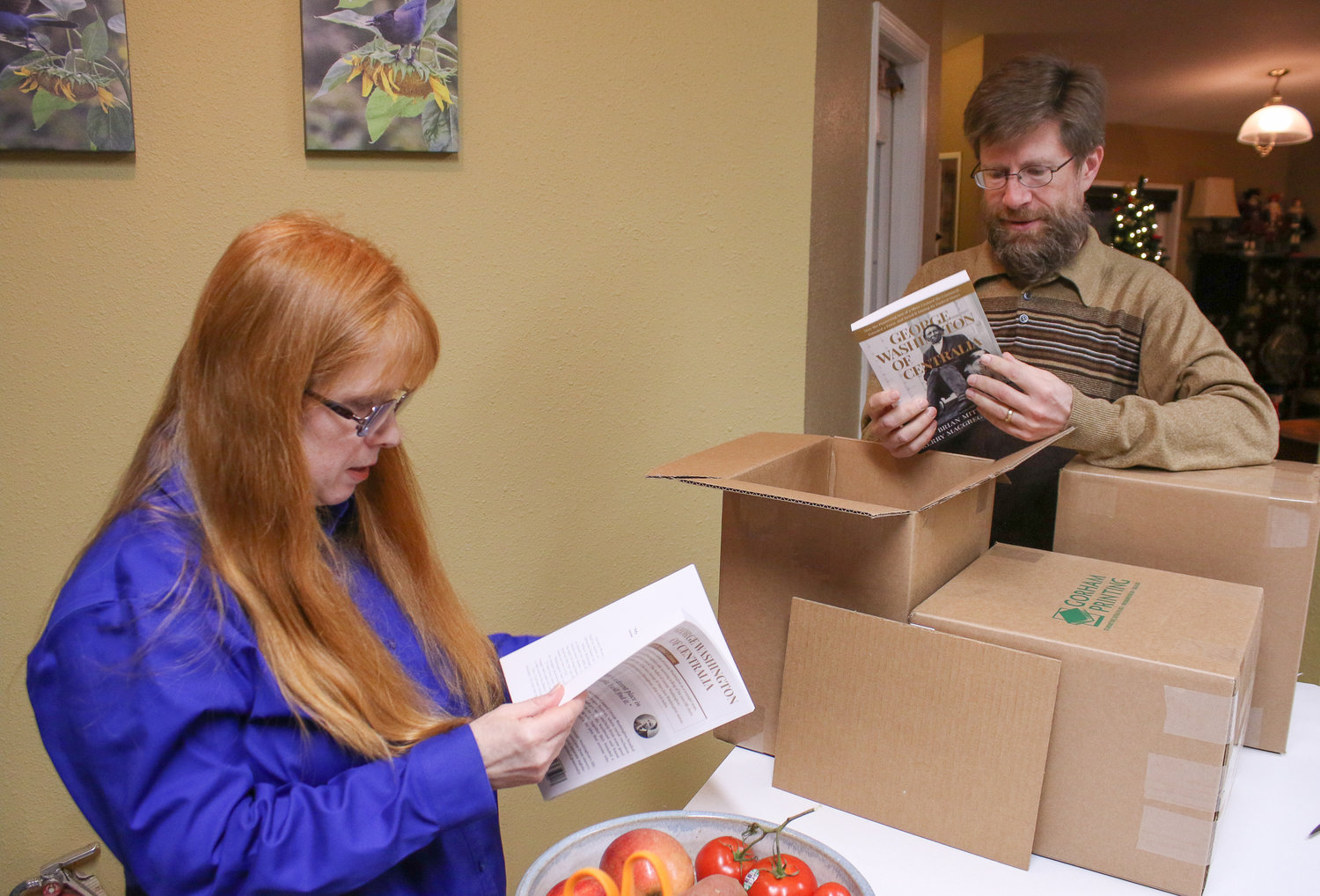 Local Authors Kerry Serl and Brian Mittge unbox the newly printed second editions of their biography titled George Washington of Centralia.
