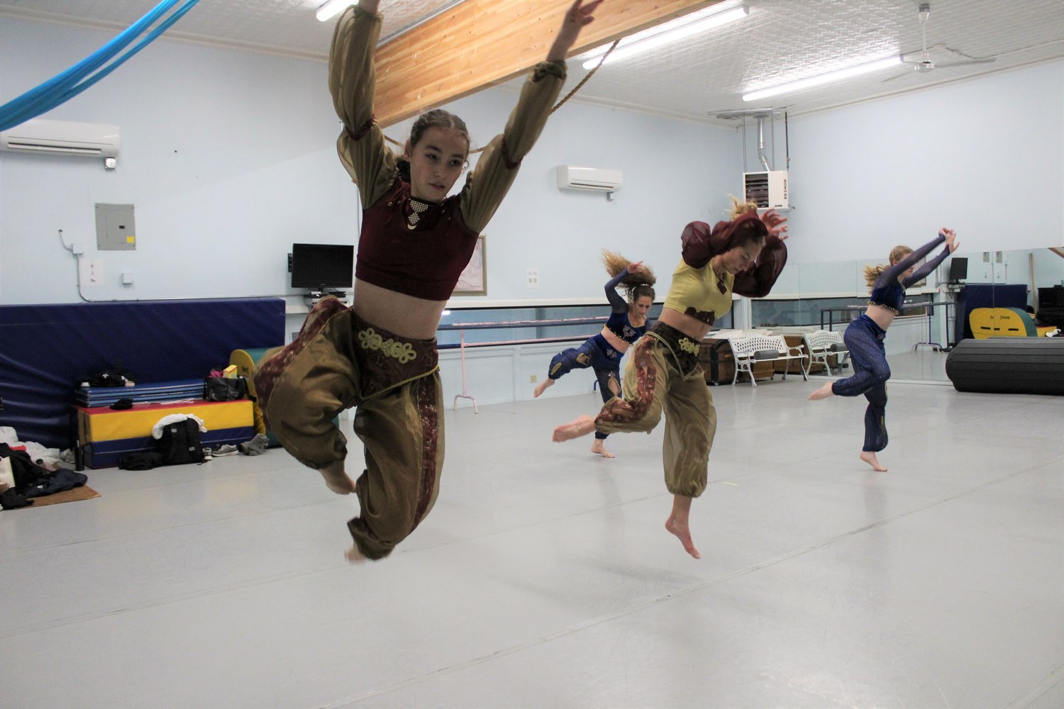 Capri O'Neill, Brianna Jones, Eva Reynolds and Stacy Jones leap during a portion of the Arabian Corps performance for "The Nutcracker Ballet."