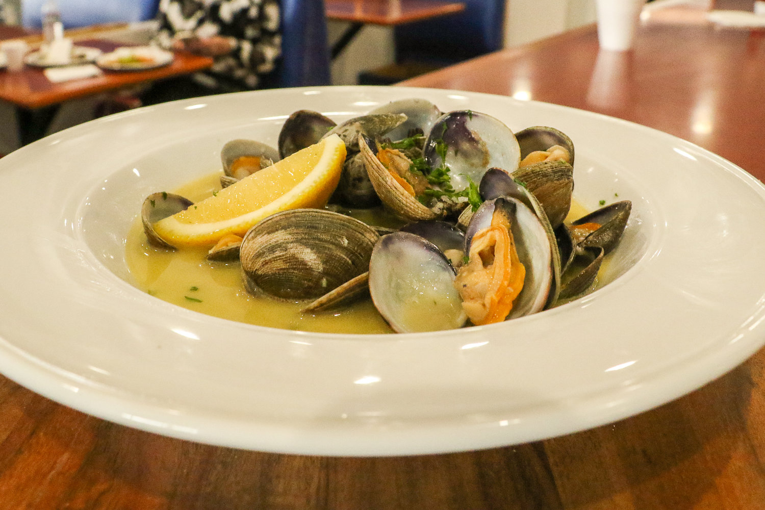 Clams in butter sauce are served up for sampling by Chef Eyner "Rene" Cardona at his new restaurant in Chehalis, Ocean Prime.