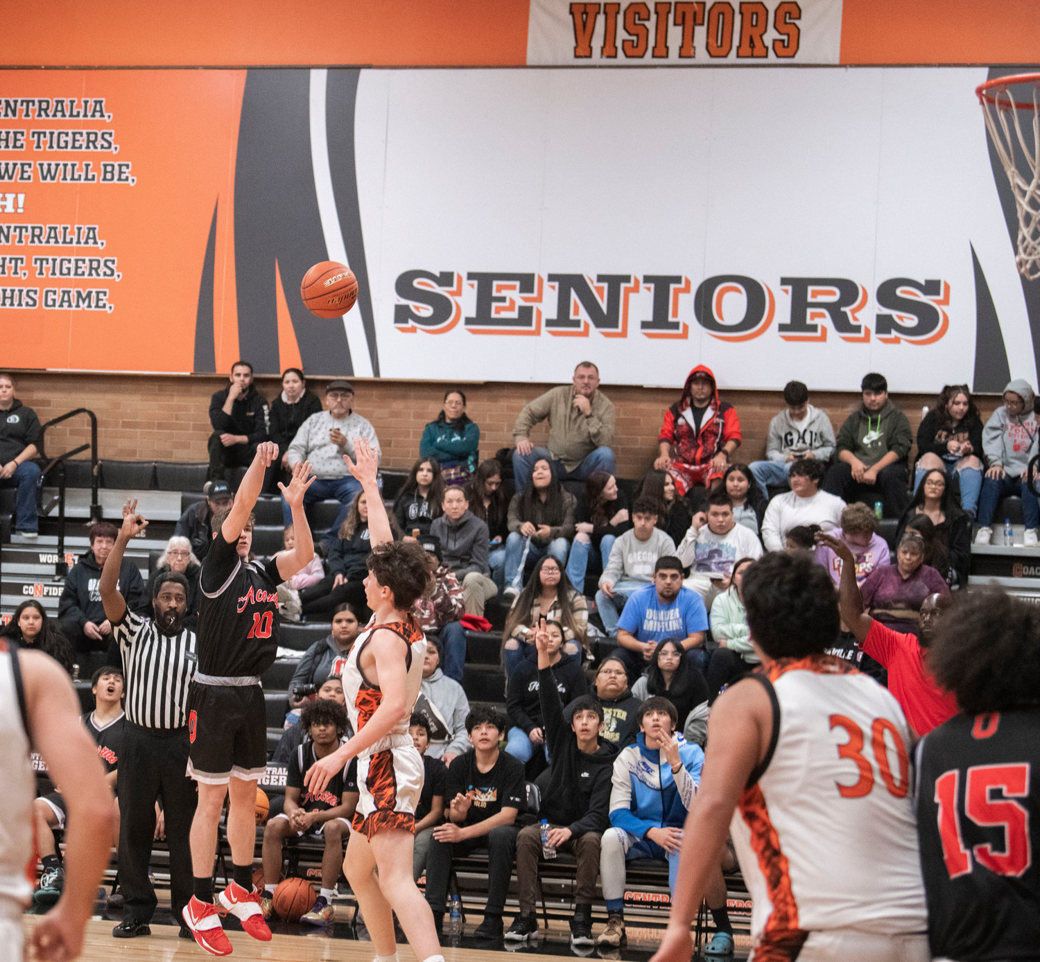 Oakville’s Hunter Russell (10) puts up a 3-point shot Monday night during a game against Centralia.