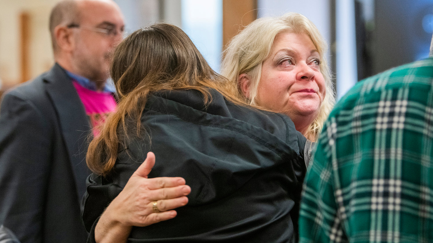 Outumuro's mother, Hope Schumacher, is embraced following a sentencing hearing for Cristopher Allen Gaudreau in Lewis County Superior Court Wednesday morning in Chehalis.