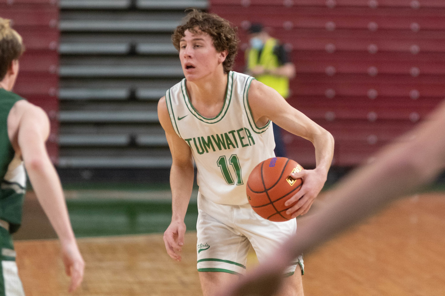 Tumwater guard Luke Brewer dribbles up the floor against Port Angeles in the 2A State Fourth-Place game at the Yakima Valley SunDome March 5.