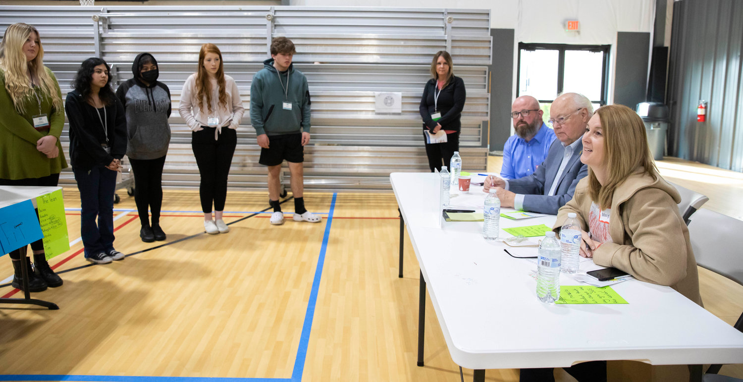Centralia Mayor Kelly Smith Johnston talks to students participating in Washington Business Week while acting as a judge Wednesday morning at the Northwest Sports Hub.