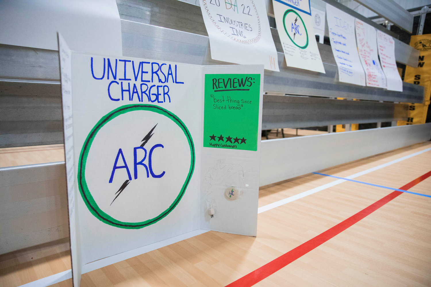 A poster sits on display for a universal charger during Washington Business Week at the Northwest Sports Hub in Centralia.