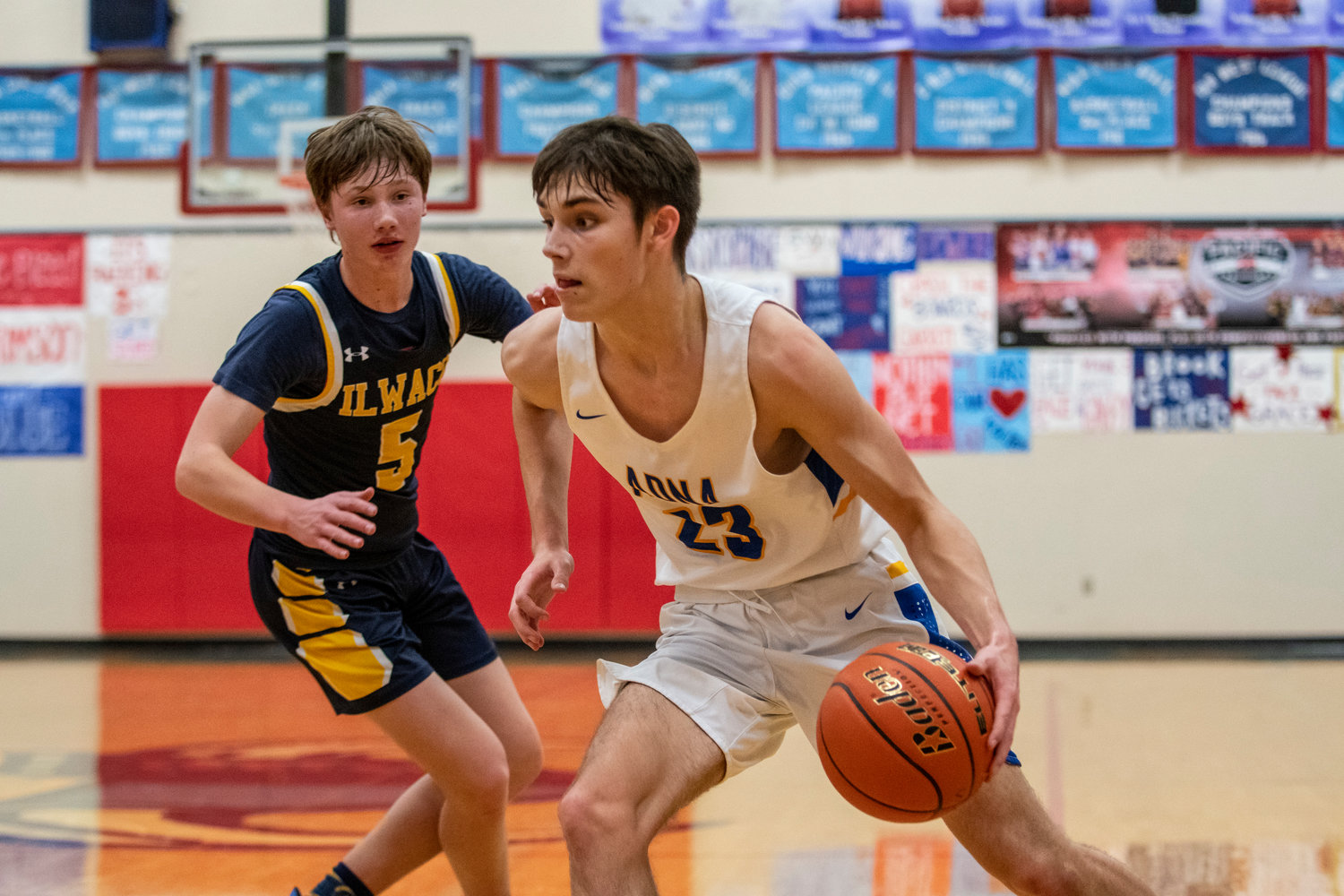 Adna junior Eli Smith (23) drives against Ilwaco's Ethan Hopkins (5) during the Jack Q. Pearson Holiday Classic in Menlo on Dec. 29.
