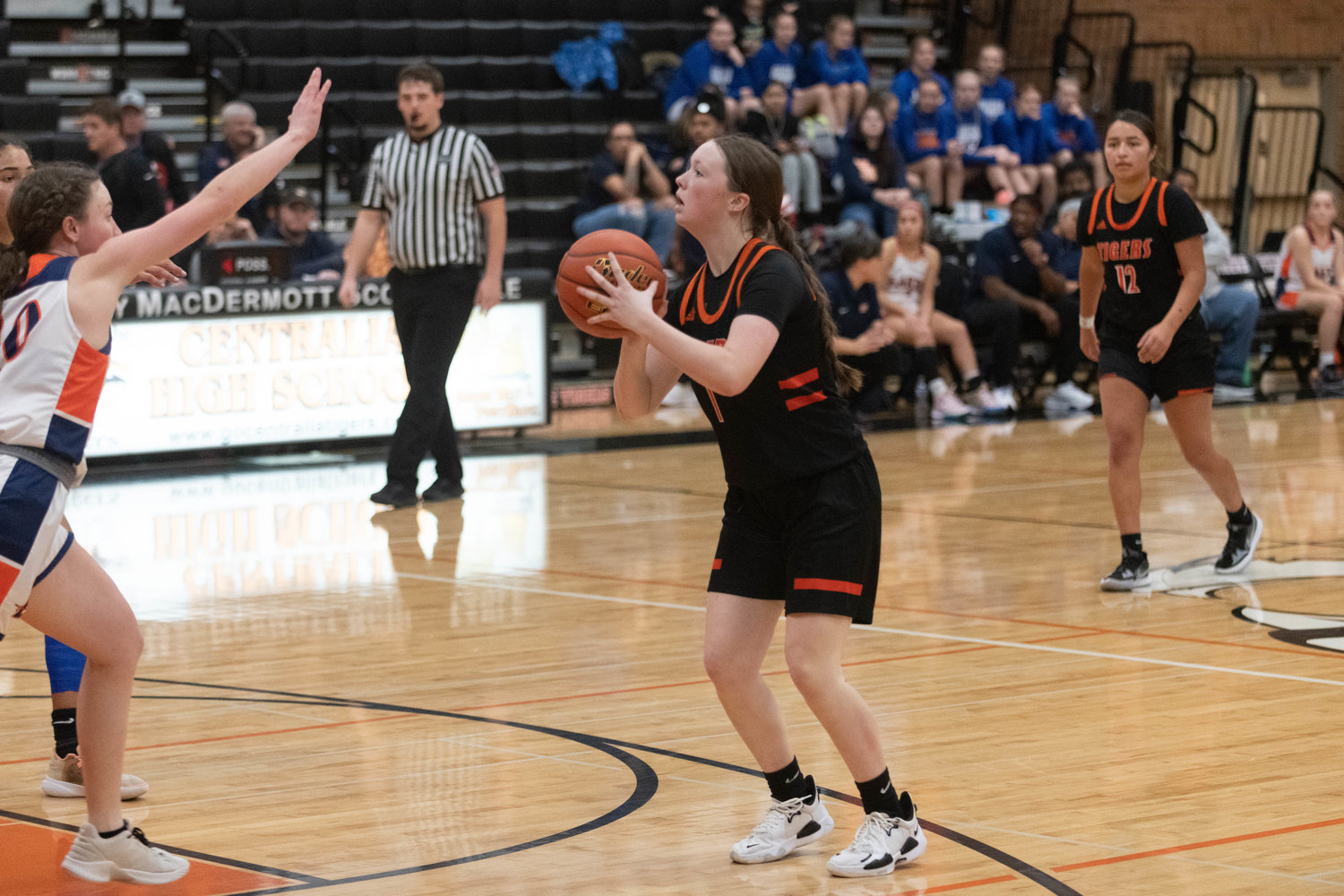 Gracie Schofield winds up for a shot during the second half of of Centralia's 54-37 loss to Lakes on Dec. 30.