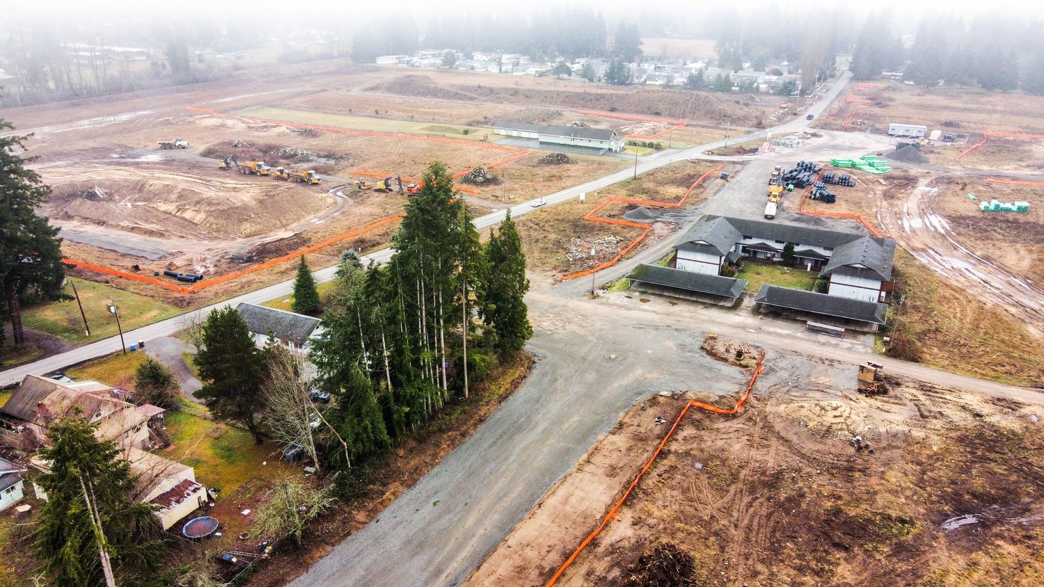 The Centralia Station project is seen through fog from above Monday morning. The multi-use development, located near Mellen Street, is a Port of Centralia project. A new WinCo store will be the anchor tenant at the development. WinCo Foods is a warehouse-style supermarket chain that offers a long list of bulk food items. All of its locations are open 24 hours a day. A solid date for the completion of the project has not been announced. 