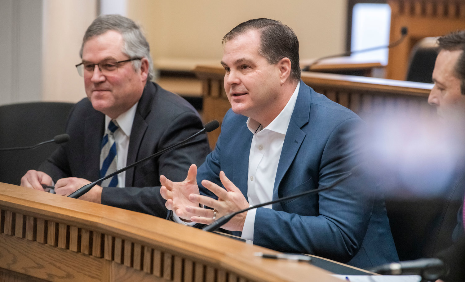 State Rep. J.T. Wilcox, R-Yelm, and Sen. John Braun, R-Centralia, talk to members of the press inside the John A. Cherberg Building in Olympia earlier this month.