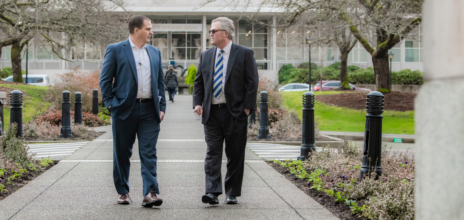 Sen. John Braun, R-Centralia, walks alongside State Rep. J.T. Wilcox, R-Yelm, outside the Washington State Capitol Building in Olympia in early January.