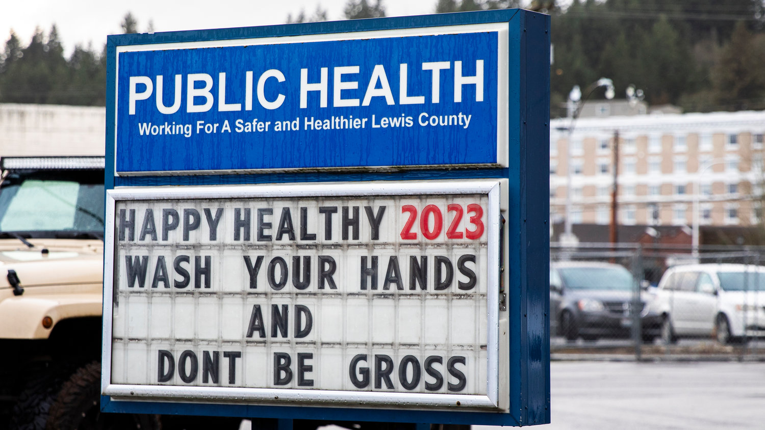 A sign sits on display outside the Lewis County Public Health building encouraging readers to “wash your hands and don’t be gross” in Chehalis in early January.