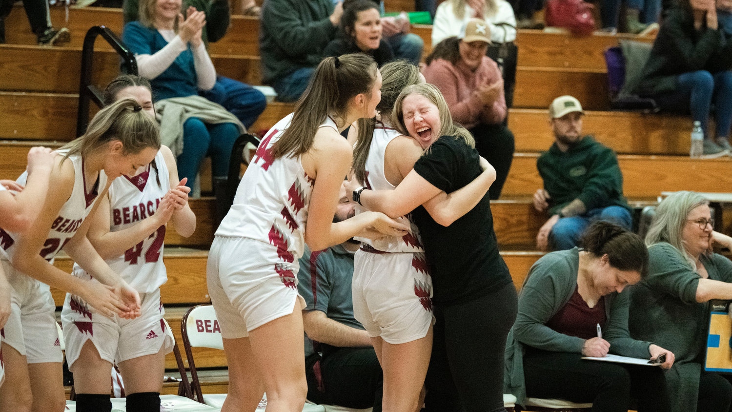 Bearcats embrace and celebrate a score during a game against Rochester in Chehalis Thursday night.