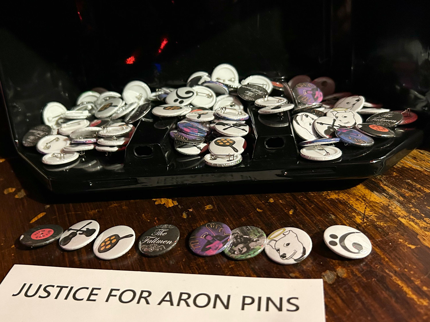 Pins created by Smmart Studios  in honor of Aron Christensen are on display at Dante’s in Portland on Friday during a 50th birthday celebration for Christensen.