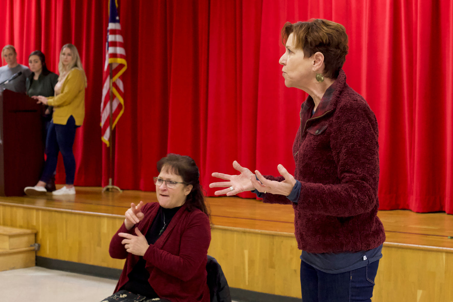 Anne Marie, a Tenino-area resident, speaks to fellow attendees of a community meeting at Tenino High School on Sunday.