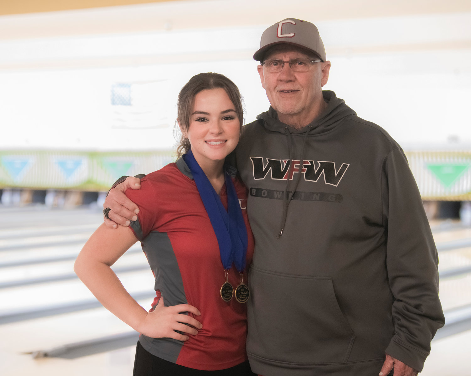 W.F. West’s Clara Bunker poses for a photo with Coach Rich Bunker after bowling at Westside Lanes in Olympia.