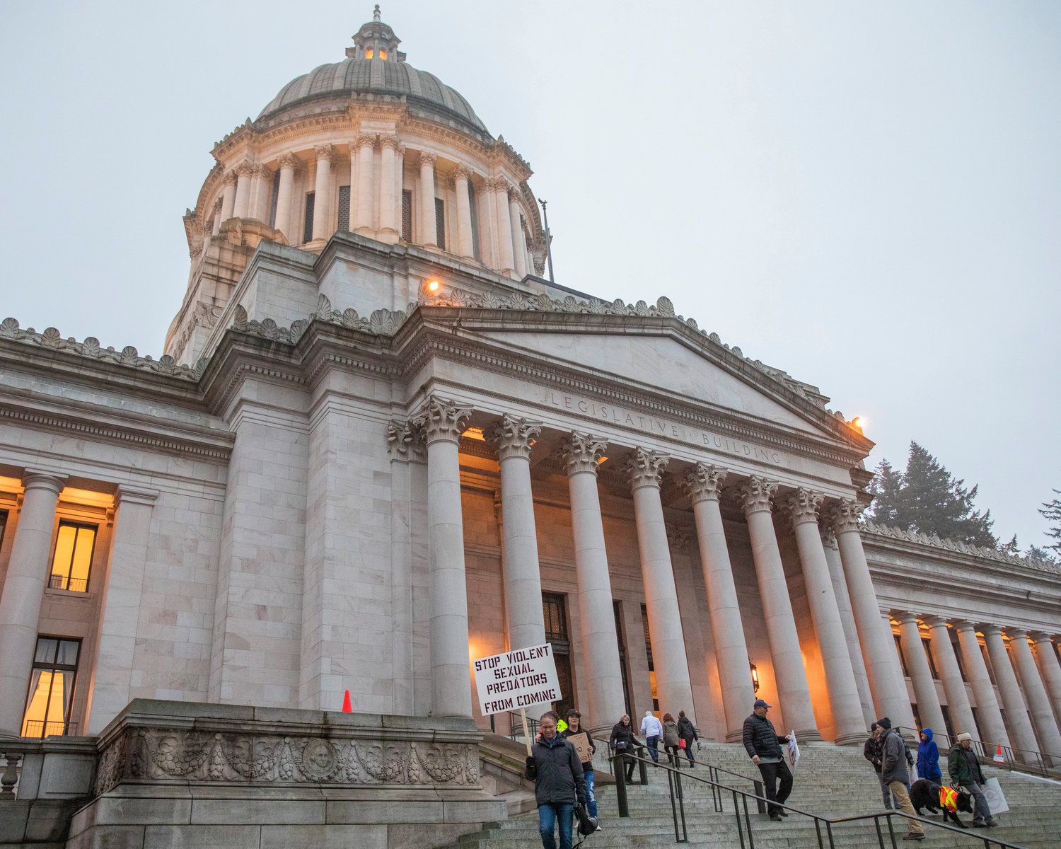 Tenino residents protest Supreme Living outside the Washington State Capitol building in Olympia on Thursday.