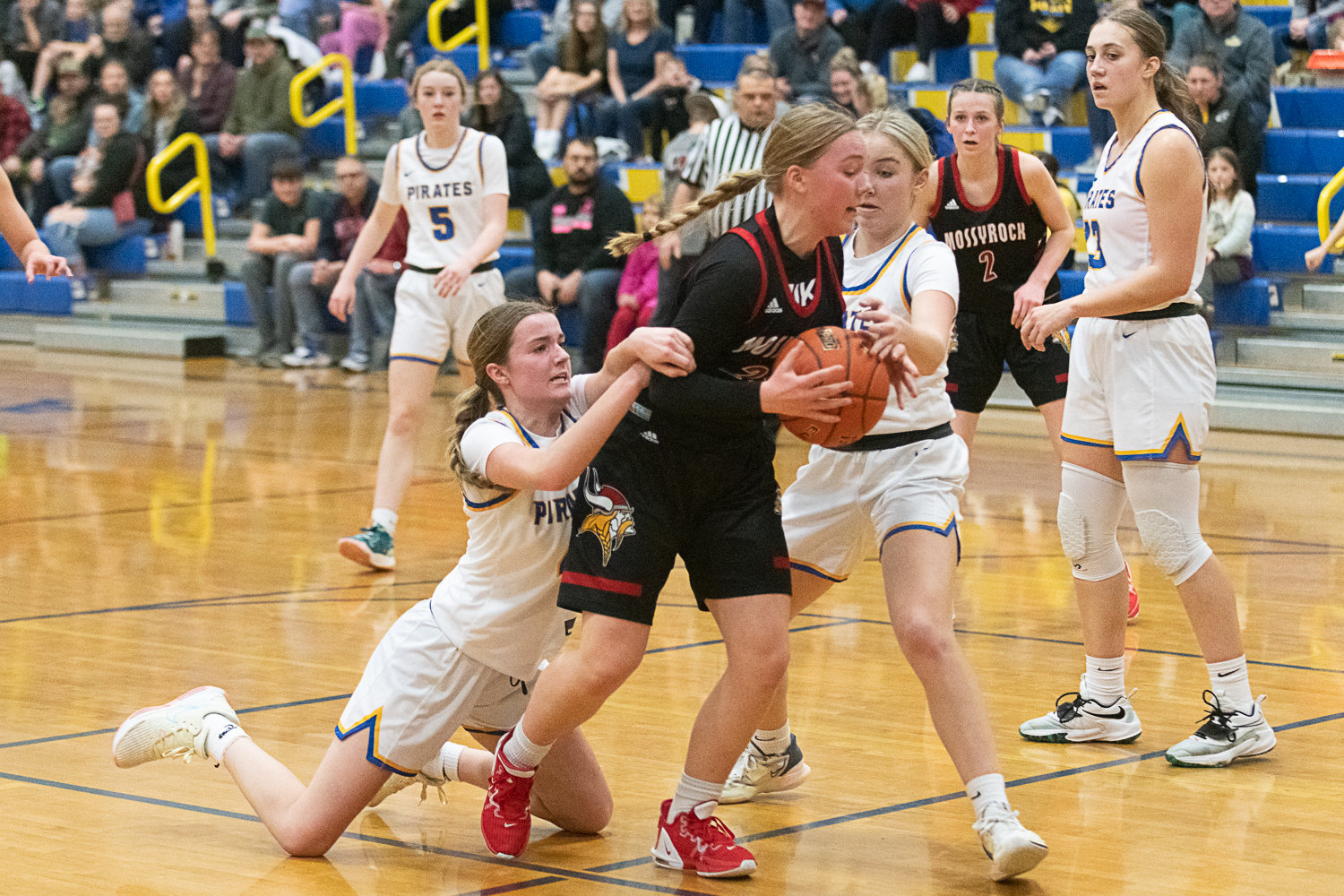 Adna's Brooklyn Loose gets a bit too much of Mossyrock's Delaney Marshall during the Pirates' 58-48 win over the Vikings on Jan. 27.