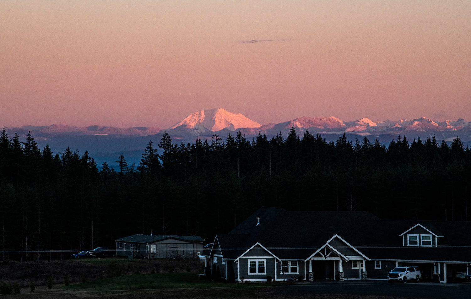 Mount Adams rises over the horizon as seen from Brown Road in Adna on Sunday night.