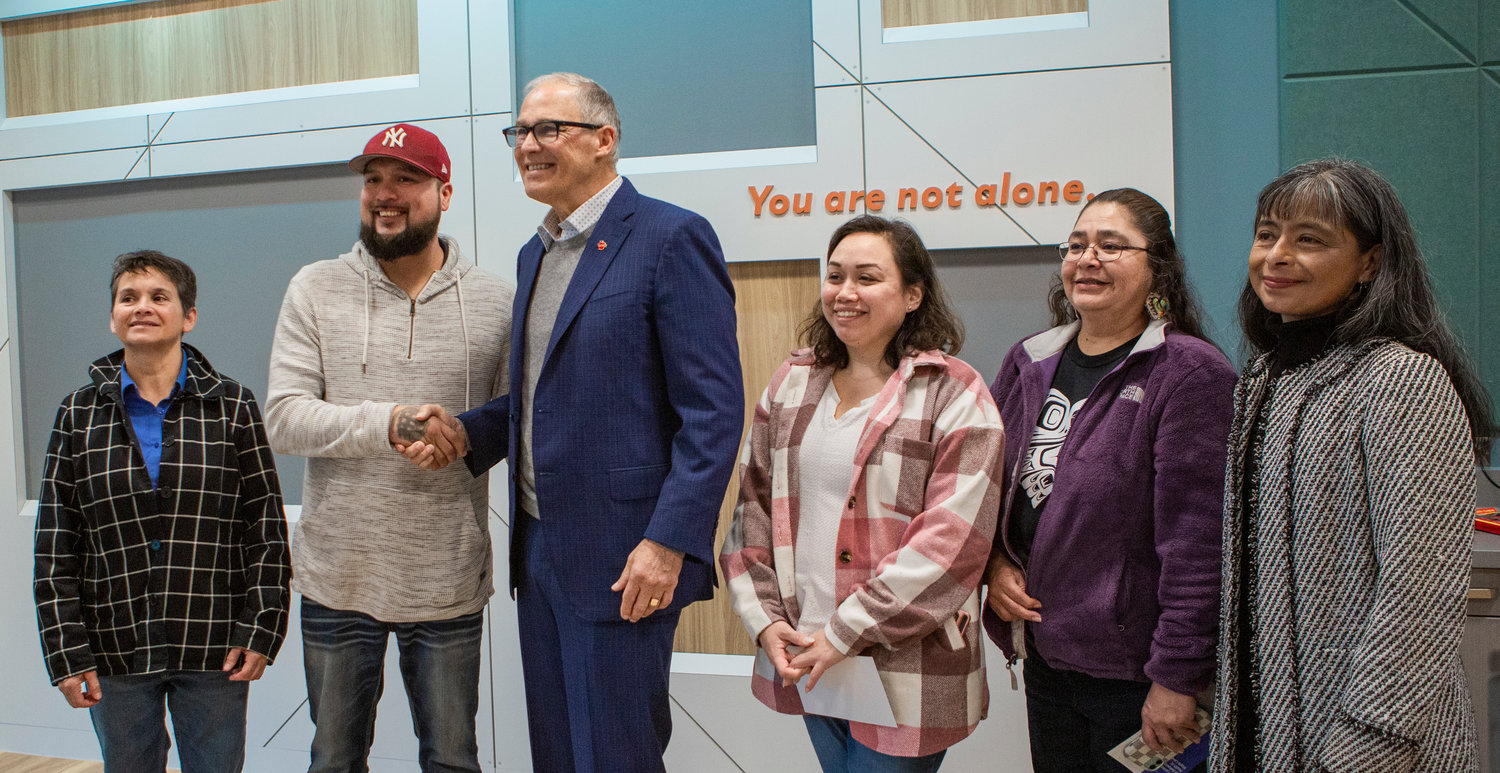 Gov. Jay Inslee smiles for a photo during a grand opening of a new facility at Maple Lane School on Friday with officials from the Chehalis Tribal Council and the secretary of the state health department. From left, Sheilah Brays, treasurer, Chairman Dustin Klatush, Inslee, Fifth Council Rachelle Ferguson, Secretary Charlotte Lopez and Jilma Meneses, Secretary of the Department of Social and Health Services.
