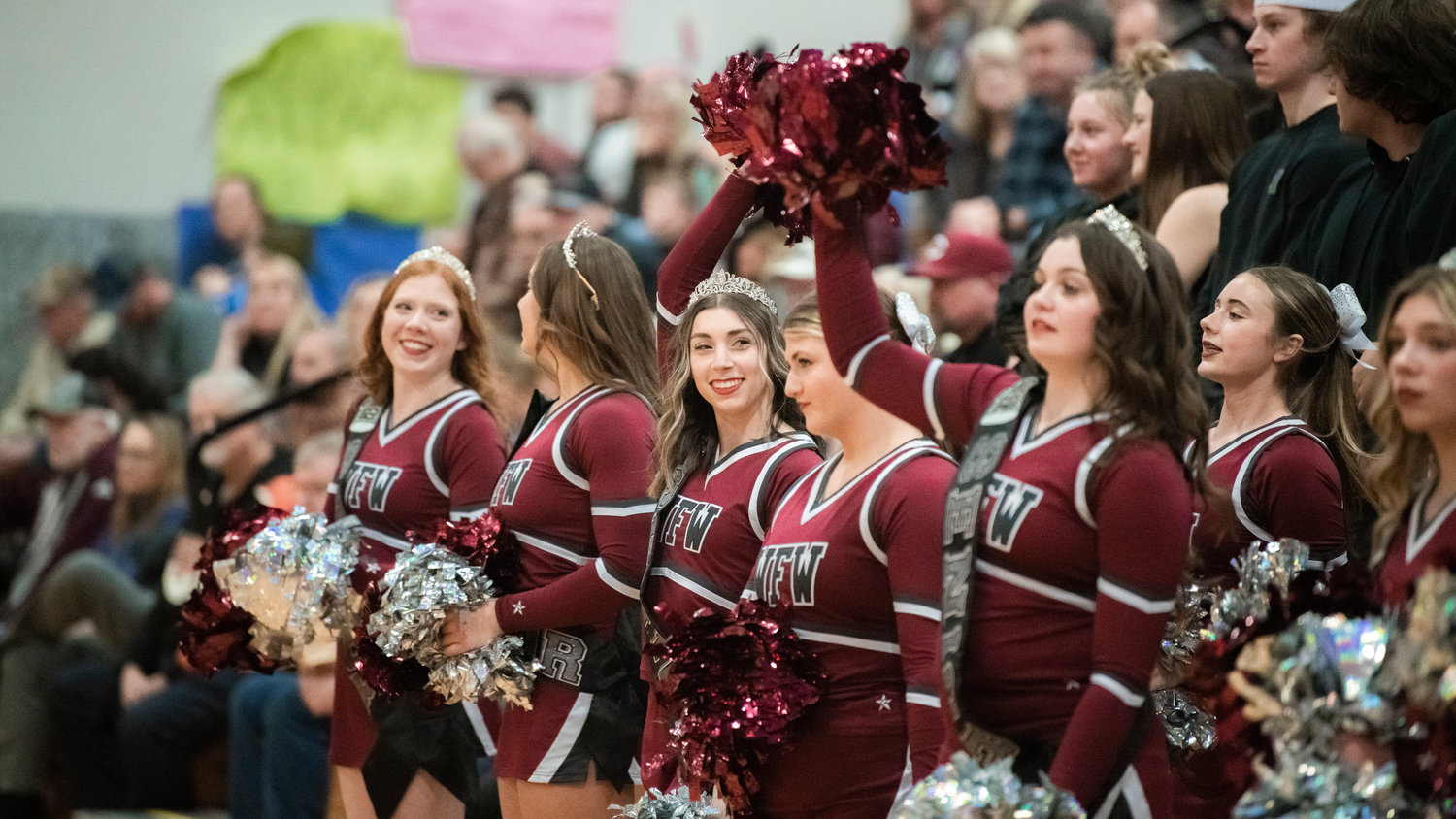 Bearcat cheerleaders shake their pom-poms during a Tuesday night game in Chehalis.