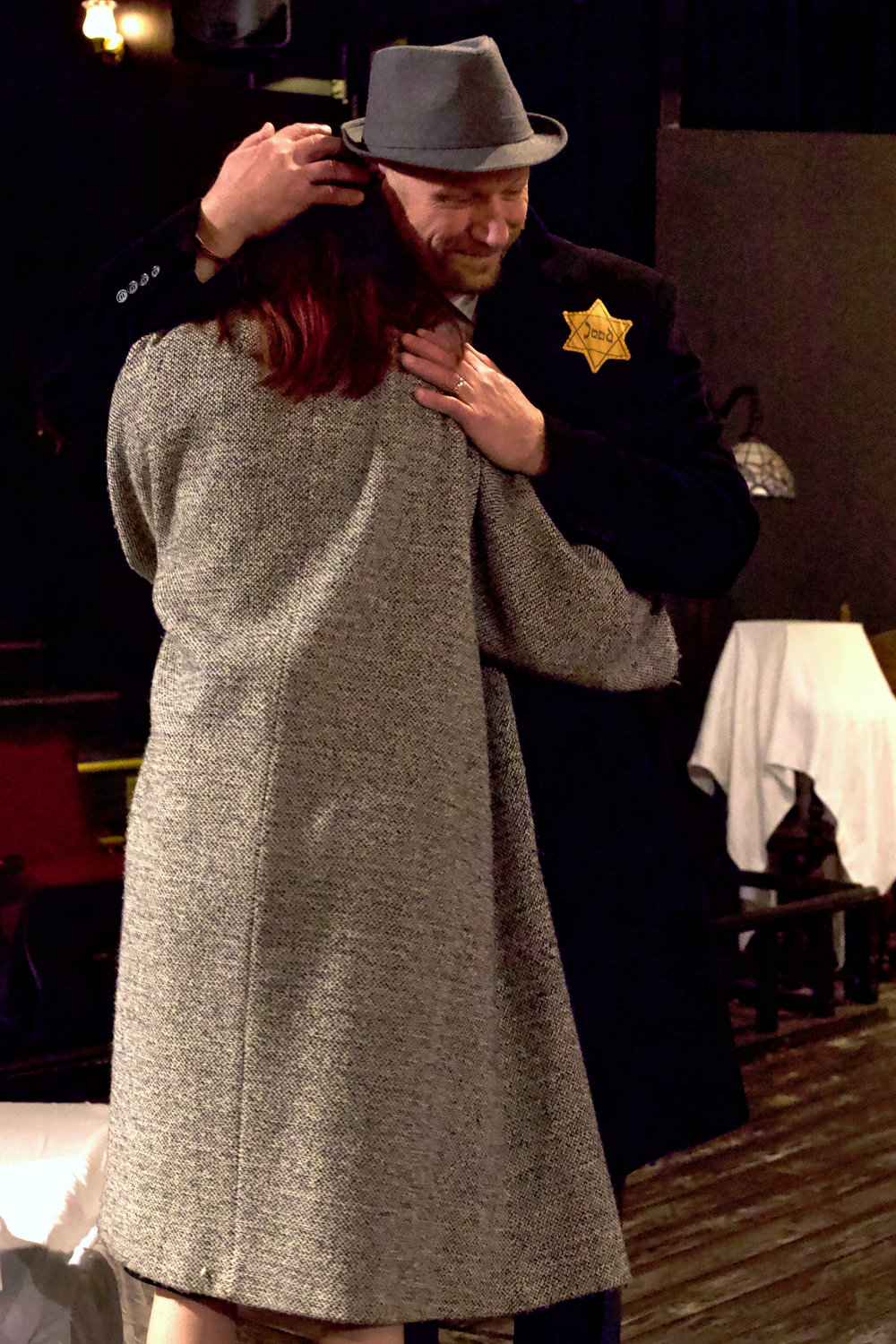 Sam Overton as Otto Frank embraces Lizze Conner as Margot Frank during a rehearsal of “The Diary of Anne Frank” at the Evergreen Playhouse in Centralia last week.