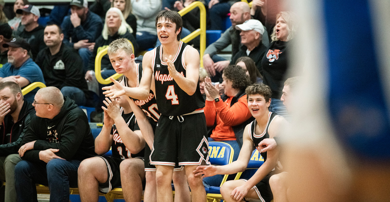 Tigers clap for teammates during a game against Adna on Thursday.