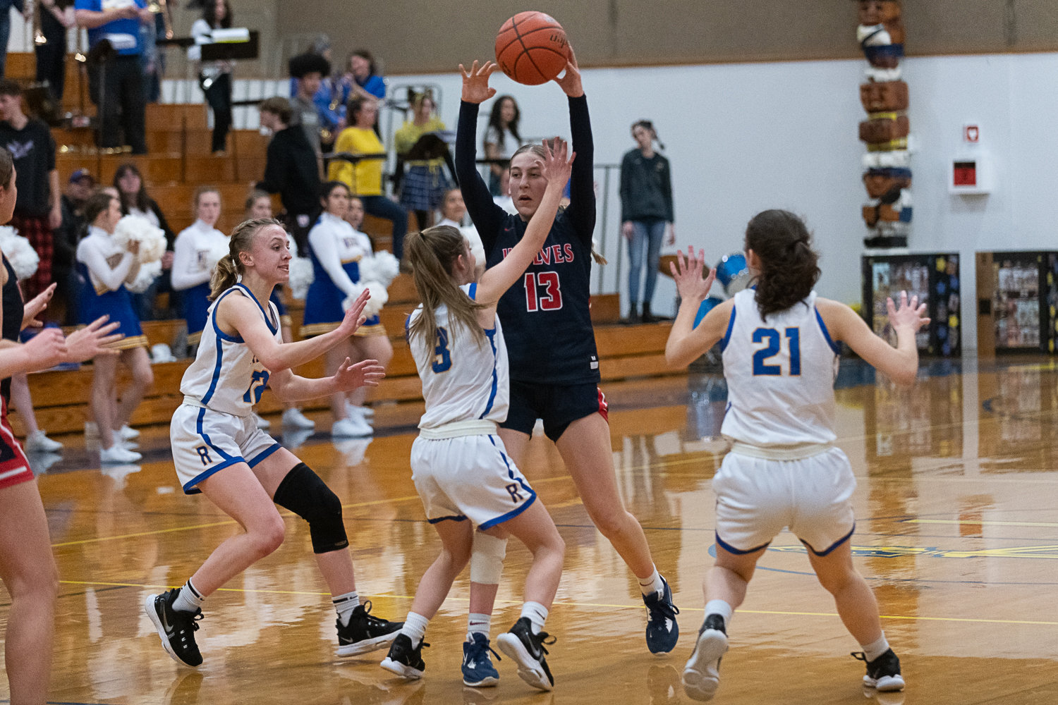 Three Rochester defenders hound Black Hills' Claire Johnson during the first half of the Warriors' 43-33 win over the Wolves on Feb. 3.