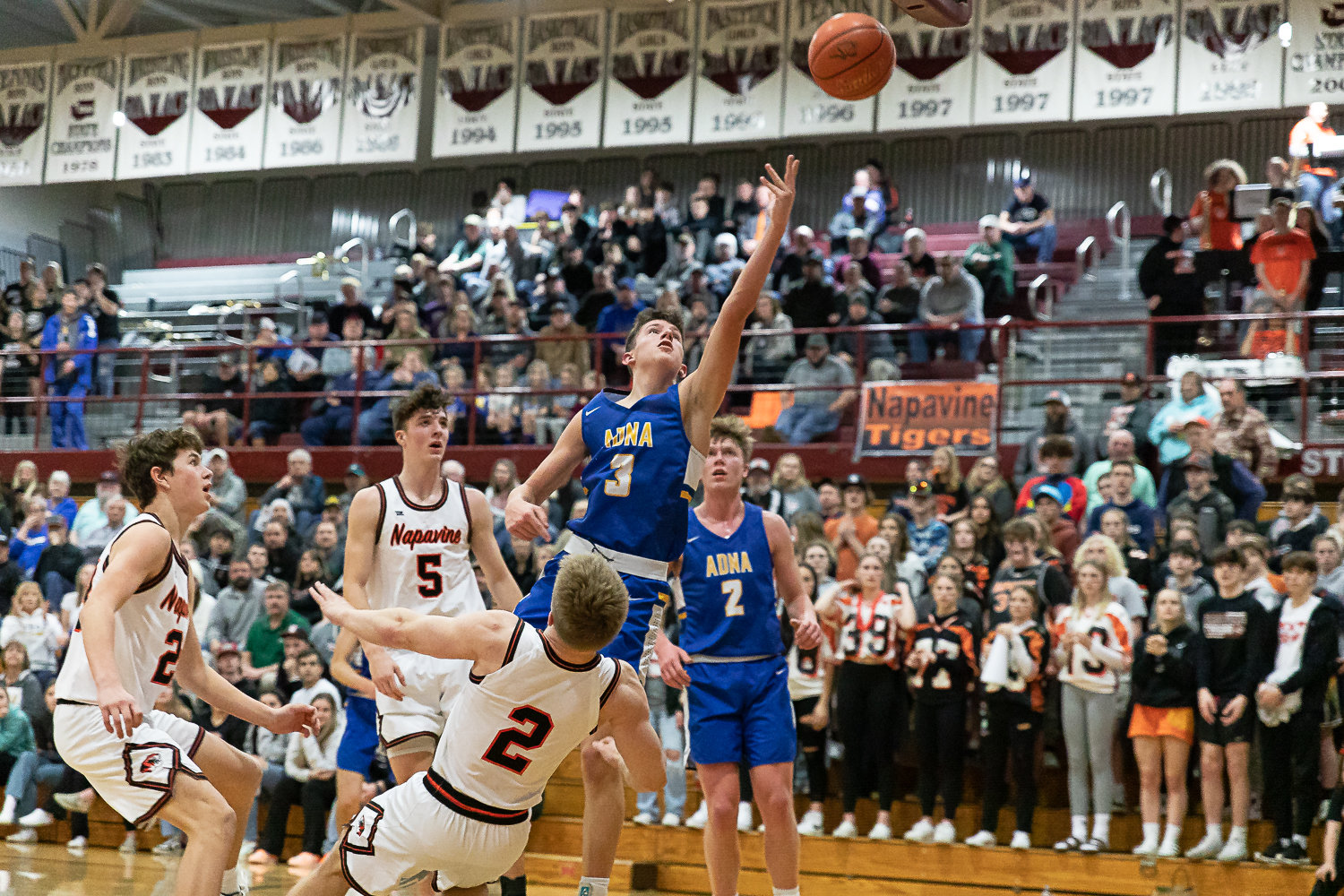 Adna guard Braeden Salme looks to make a layup while Napavine's Cael Stanley tries to draw a charge in the 2B District 4 quarterfinals at W.F. West Feb. 8.