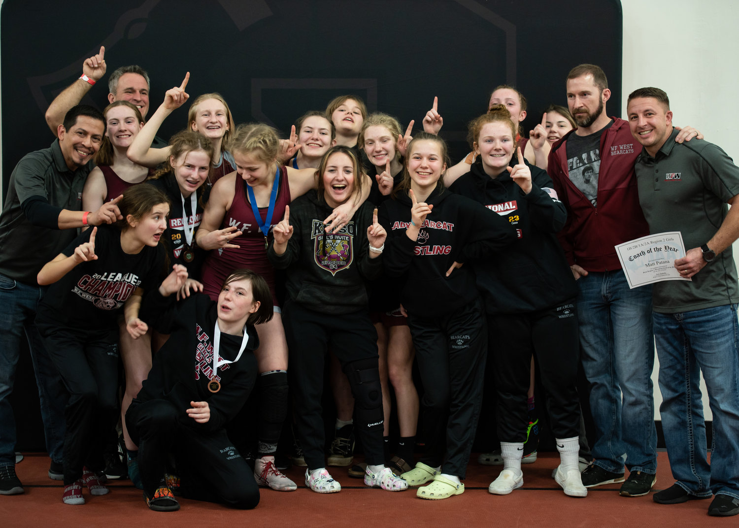 The W.F. West girls wrestling team poses for a photo after winning the 1B/2B/1A/2A Girls Regional Title at Shelton this weekend.