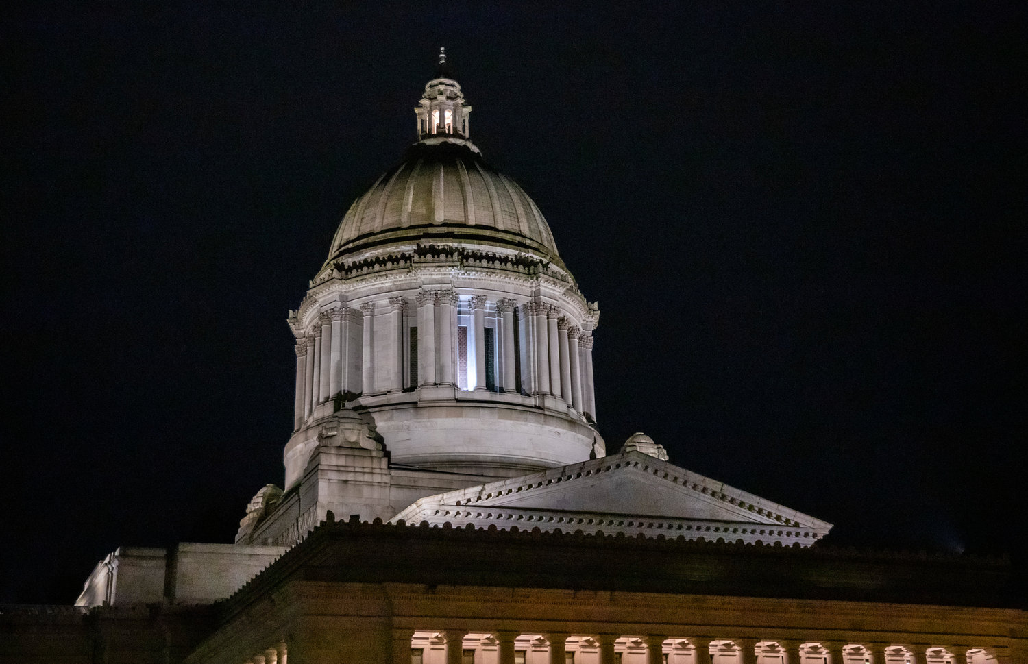 The Washington Capitol building is lit up against the night sky in Olympia on Thursday, Feb. 16.