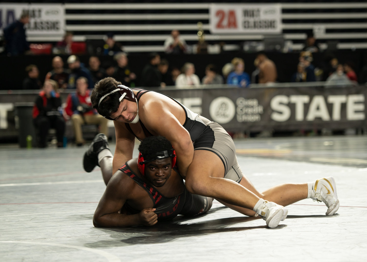W.F. West heavyweight Daniel Matagi grapples with Archbishop Murphy's Hakeim Smalls at the Mat Classic in Tacoma Feb. 17.