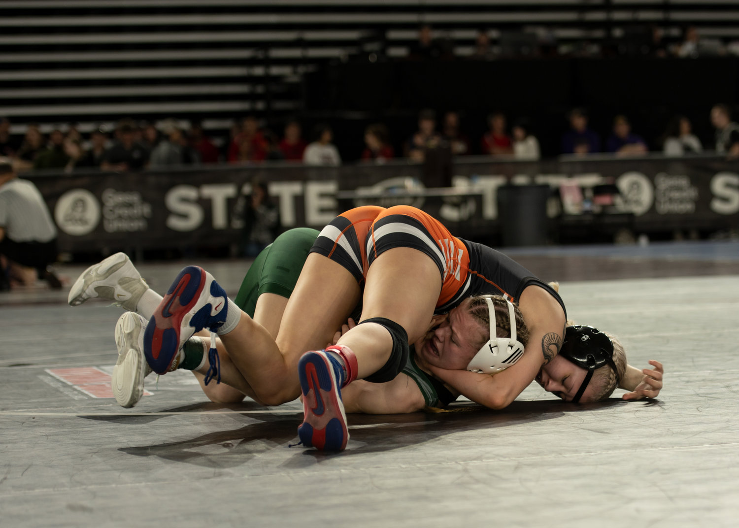 Centralia's Jade Hudson pins her opponent, Port Angeles' Faye Dachs, at the Mat Classic at the Tacoma Dome Feb. 17.