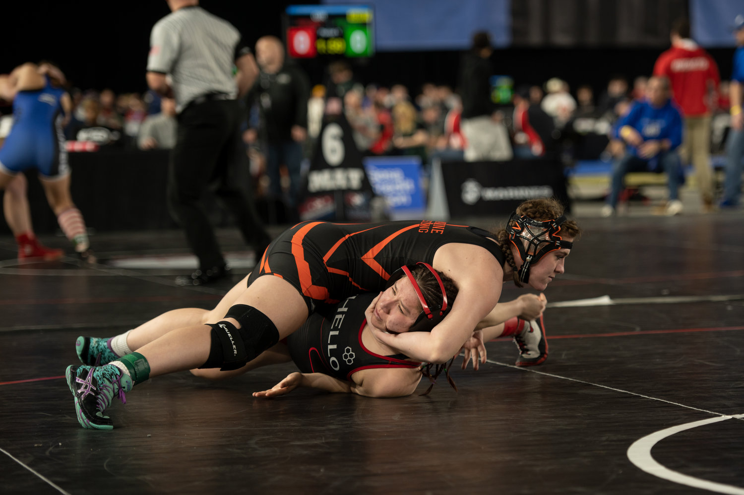 Napavine's Maya Kunkel gets close to a pin against Othello's Thalia Gallegos at the Mat Classic in Tacoma Feb. 17.