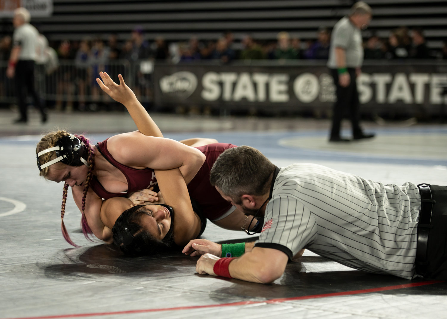 W.F. West girls wrestler Courtney Jones gets close to a pin against North Kitsap's Emily Gomez Feb. 17 at the Mat Classic.