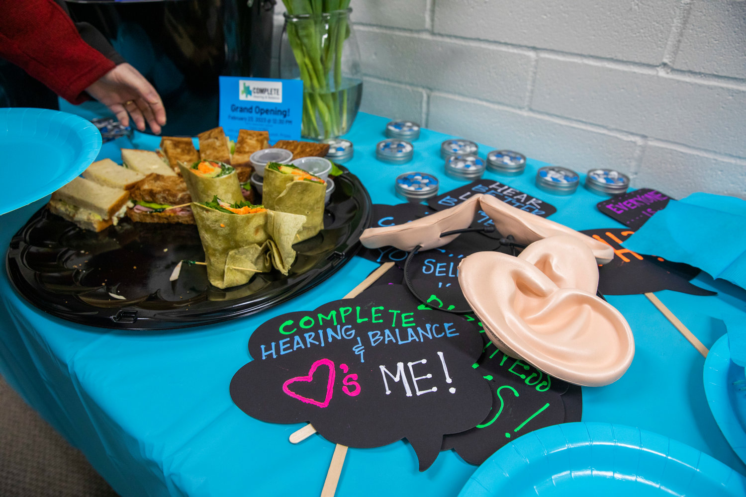 Food and foam ears sit on display during a Centralia-Chehalis Chamber of Commerce ribbon cutting ceremony at Complete Hearing and Balance in Chehalis on Thursday.