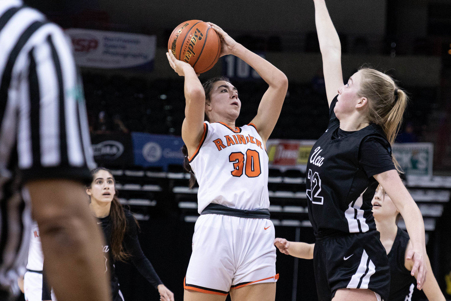 Rainier forward Acacia Murphy takes a shot against Upper Columbia Academy March 1 in the 2B state tournament round of 12 at Spokane Arena.