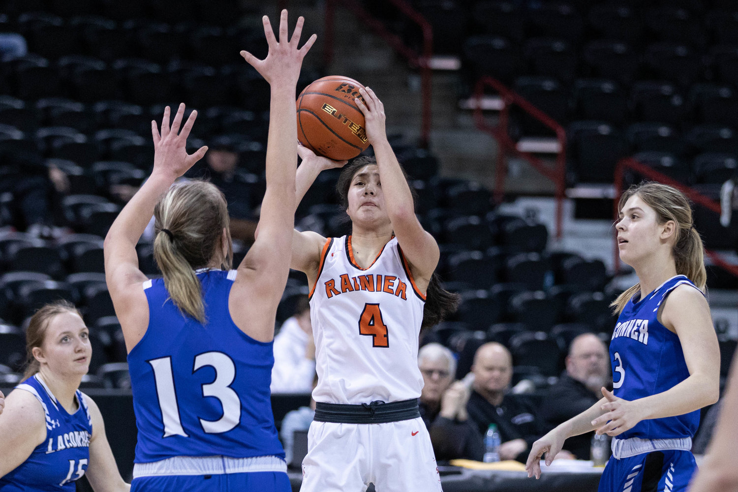 Rainier guard Angelica Askey rises for a jumper against La Conner in the 2B state consolation semifinals at Spokane Arena March 3.