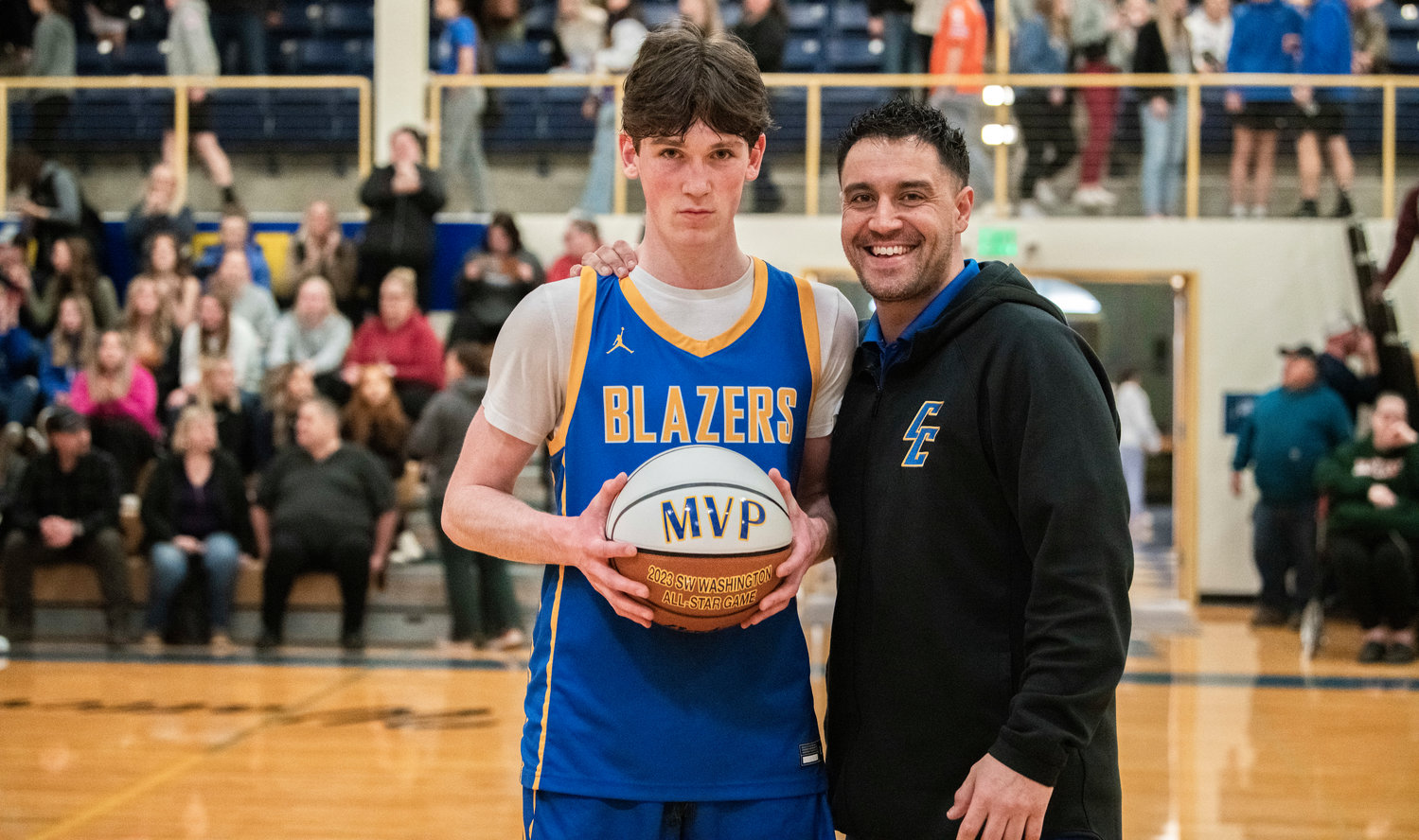 MVP Shay Brannon, of Eatonville, poses for a photo with Joe Chirhart after a Southwest Washington High School All-Star game at Centralia College Friday night.