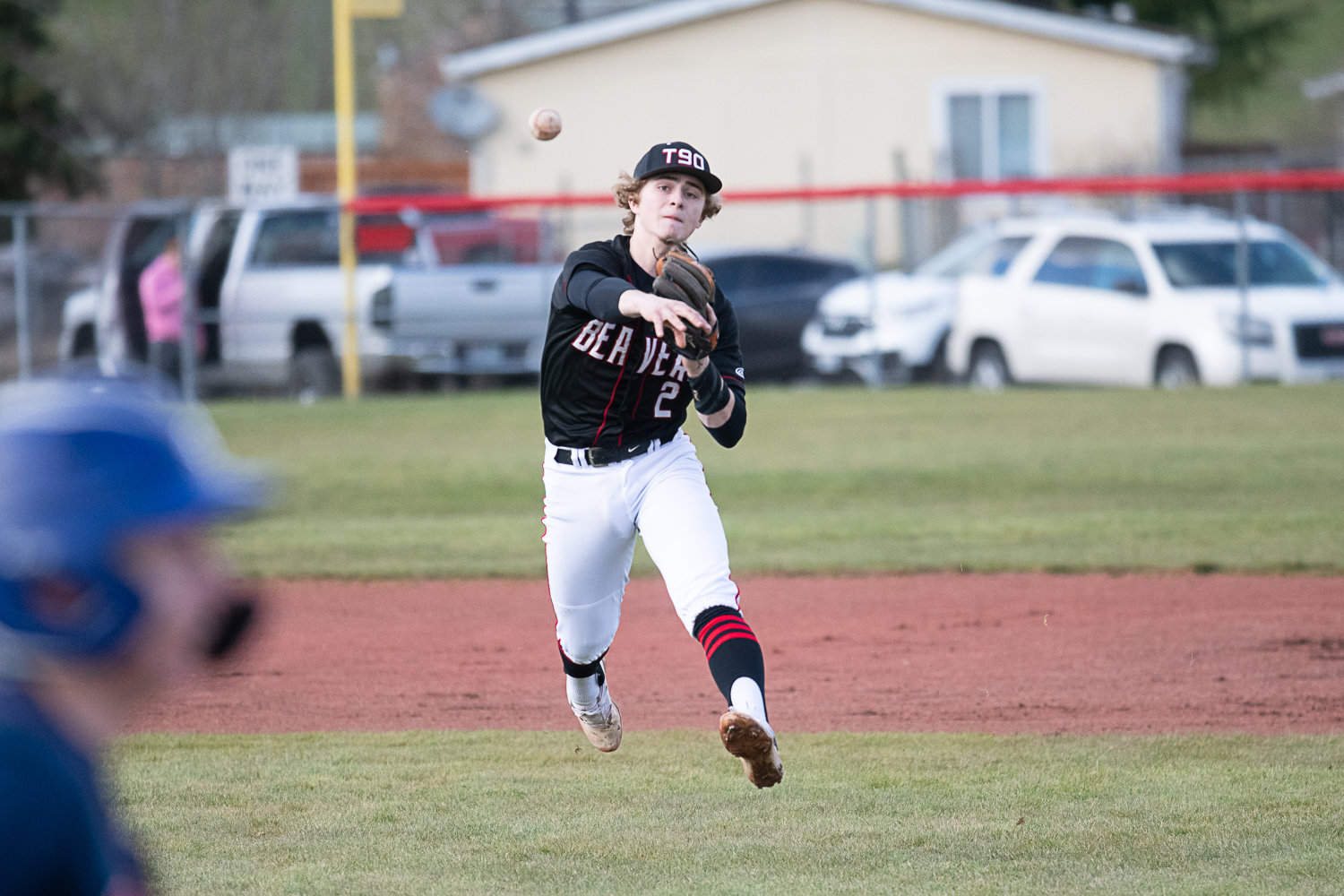 Cody Strawn tries to throw a Black Hills batter out at first during Tenino's 7-4 win over the Wolves on March 14.