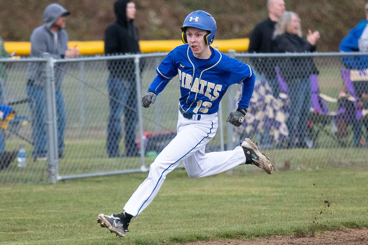 Nate Schueber heads for home to score during Adna's 10-4 win over Napavine on March 15.