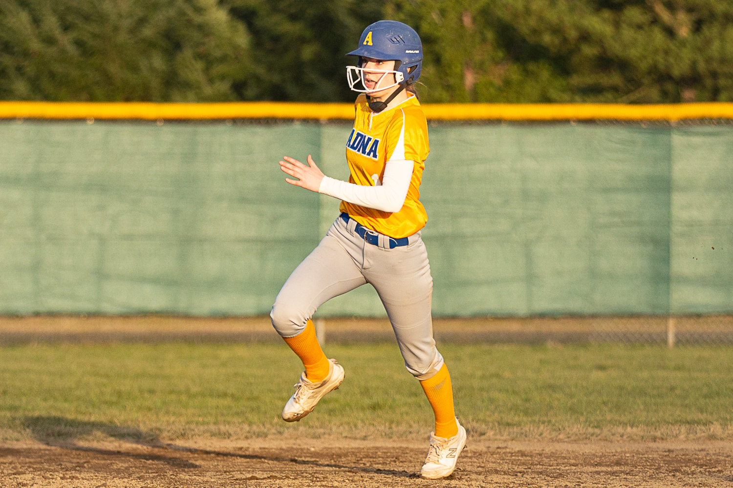 Adna's Brooklyn Loose runs along the basepath against Rochester March 15.