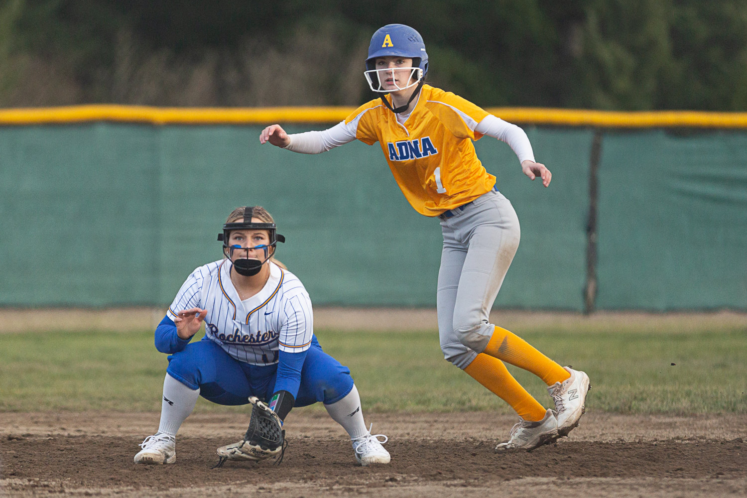 Adna catcher Brooklyn Loose (right) Rochester first baseman Kaylei Clark get ready before a pitch March 15.