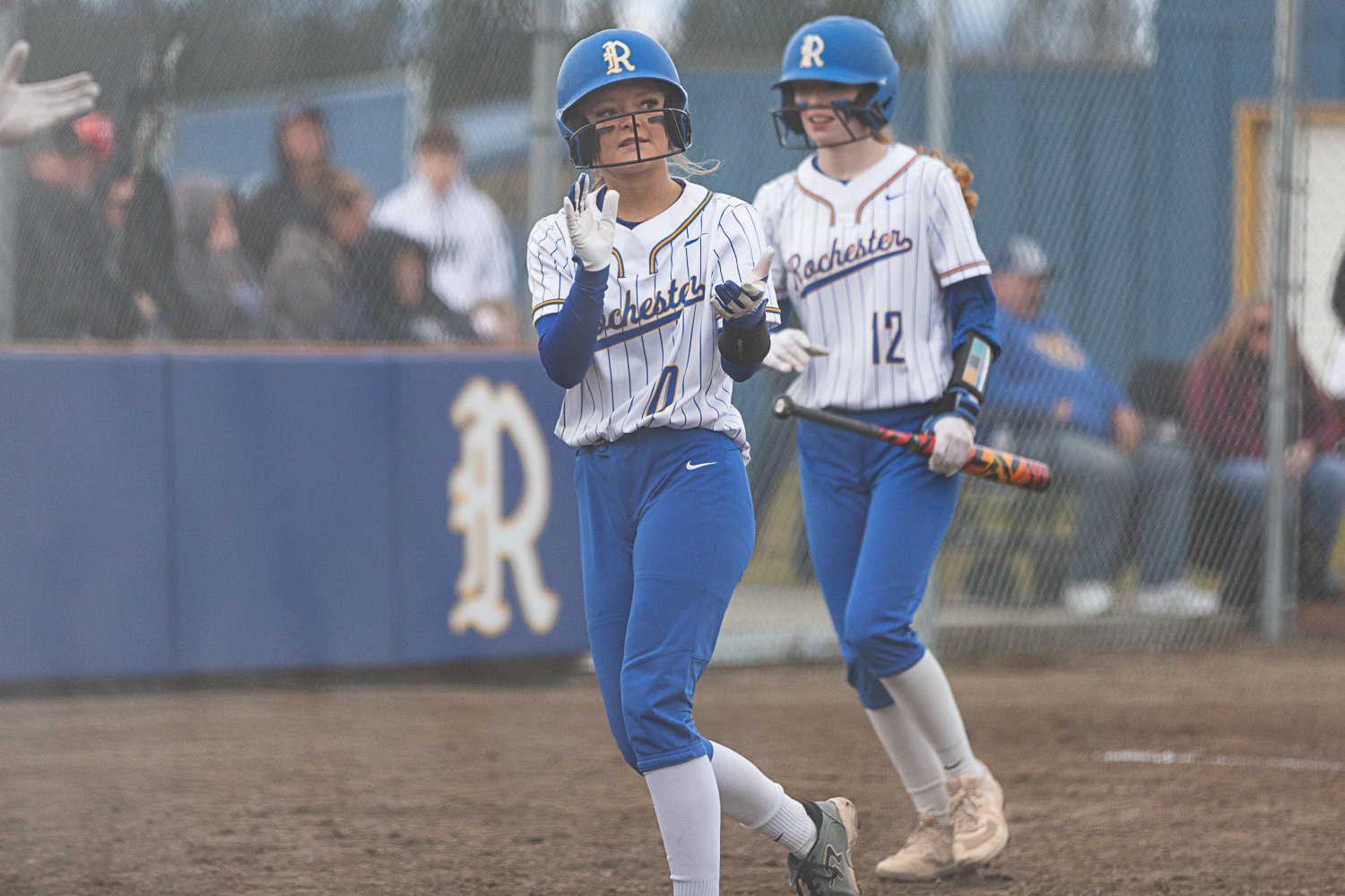 Rochester's Kaylee Demers claps after scoring a run against Adna March 15.