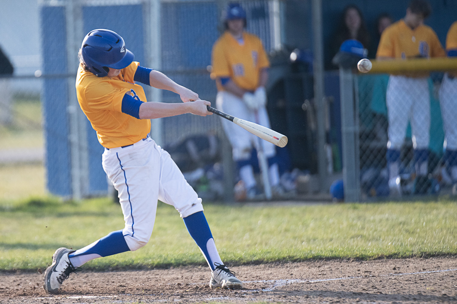 Hyde Parrish bloops a single into right field during Rochester's 15-6 win over R.A. Long on March 16.
