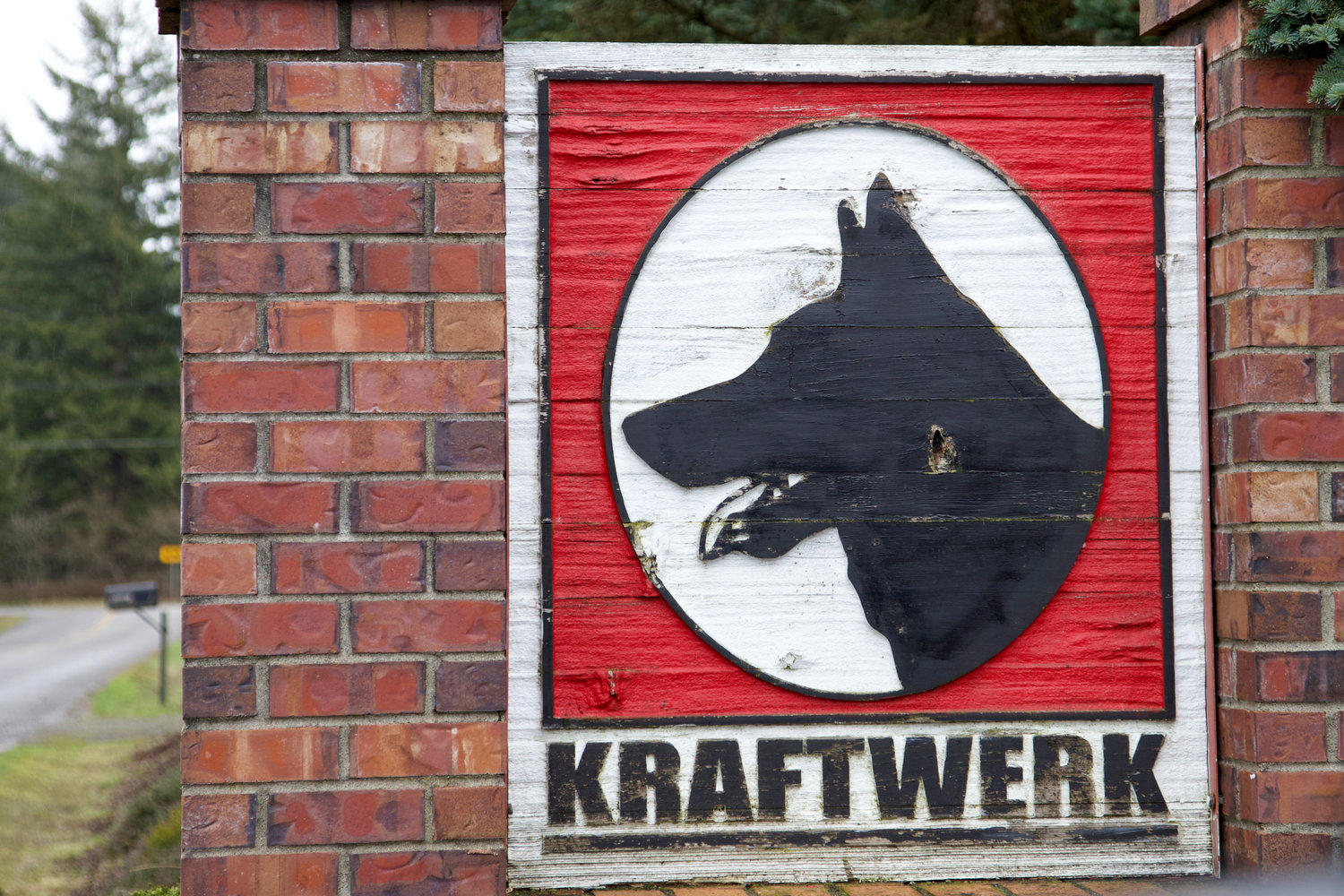 Kraftwerk K9’s sign faces the roadway outside the fenced 25-ace facility in Rochester.