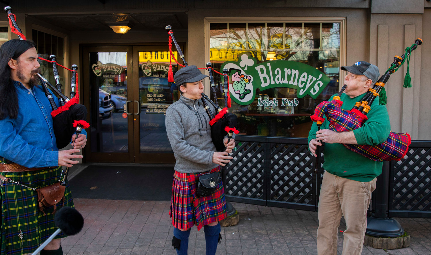 From left, bagpipers James Roush, Orion Hunter, and Mud Piper bring sounds of St. Patrick’s Day to downtown Centralia outside O’Blarney’s Irish Pub on Thursday.