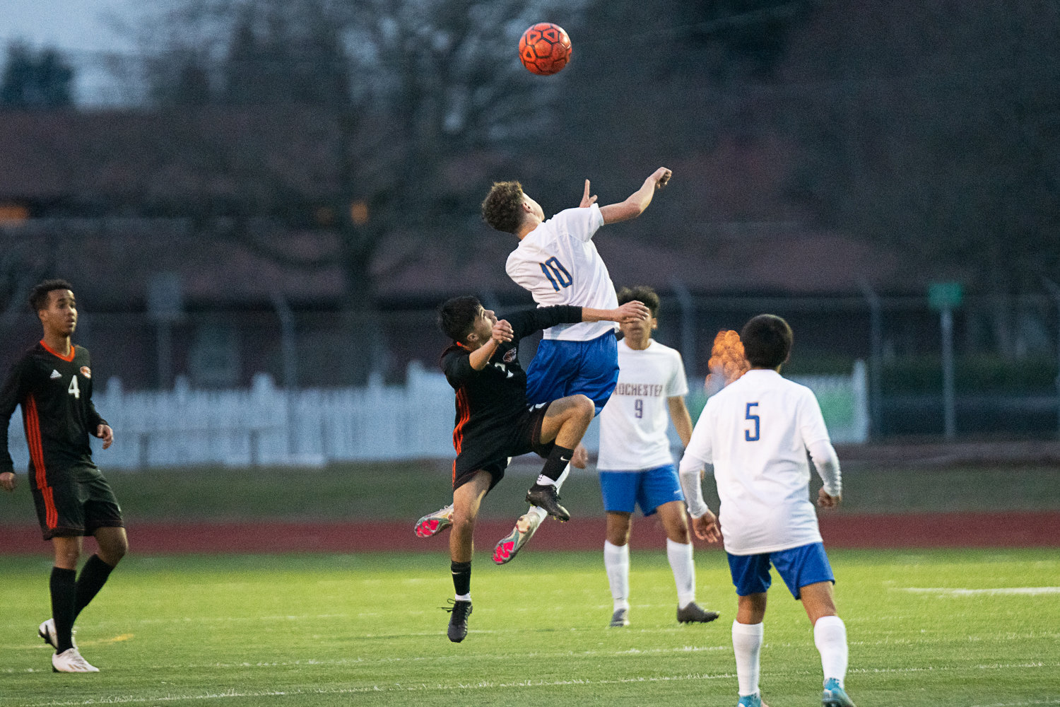 Rochester's Gabriel Fernandez Sales outjumps Centralia's Kilmer Alverto for a header during the first half of the Warriors' match against the Tigers on March 17.