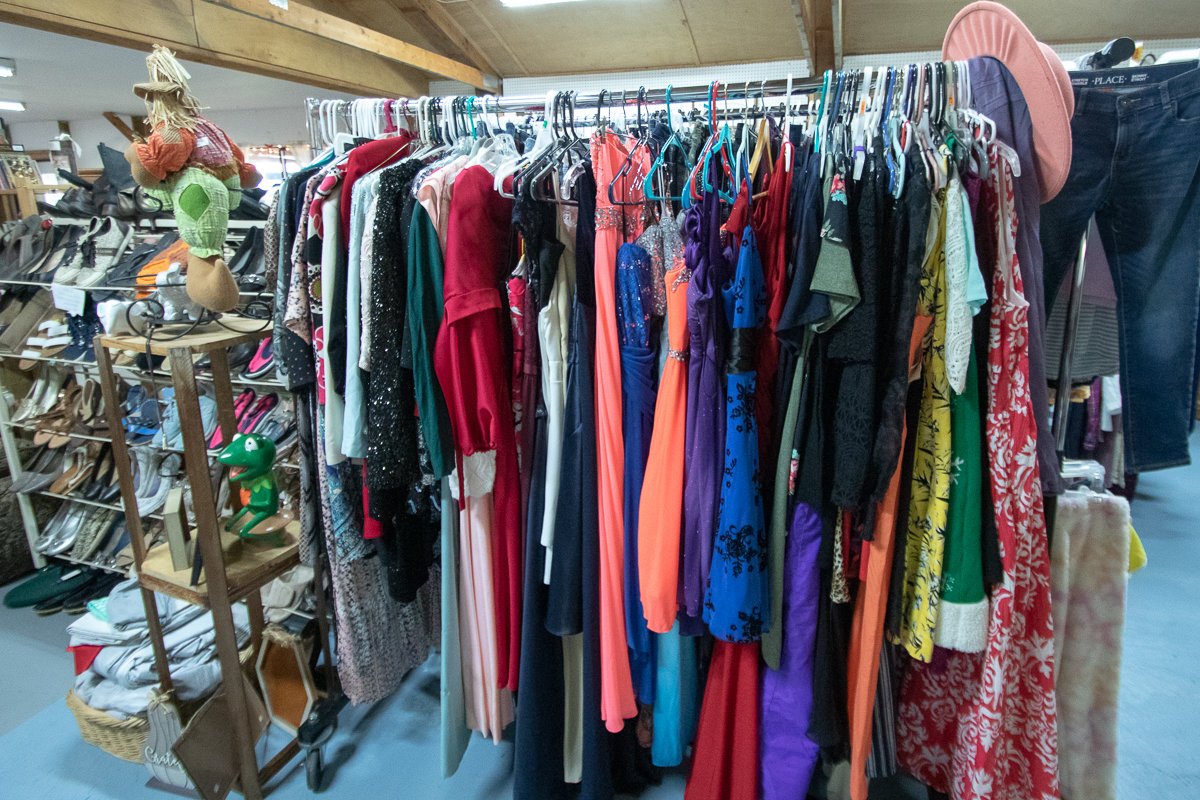 A rack of donated prom dresses sit awaiting to be given out for free at Toledo Treasures, a new thrift store located at 5484 Jackson Highway in Toledo.