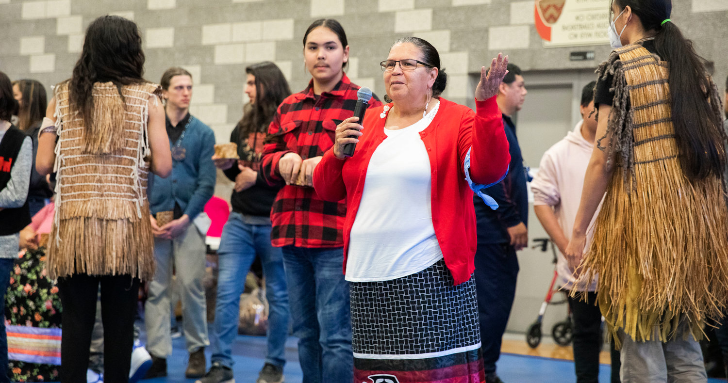 New master weaver Peggy McCloud speaks to attendees after being welcomed into the Hazel Pete family at the Chehalis Tribe Community Center in Oakville on Saturday during a ceremony.