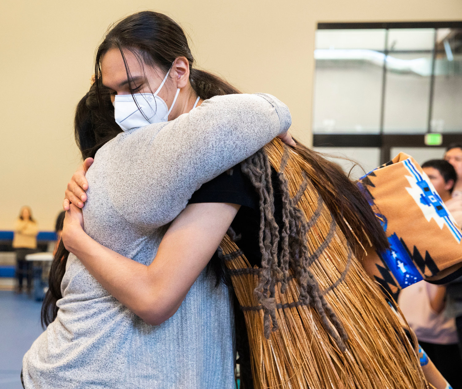 New master weaver Coby Higheagle receives an embrace after giving gifts during a ceremony honoring the Hazel Pete legacy at the Chehalis Tribe Community Center in Oakville on Saturday.
