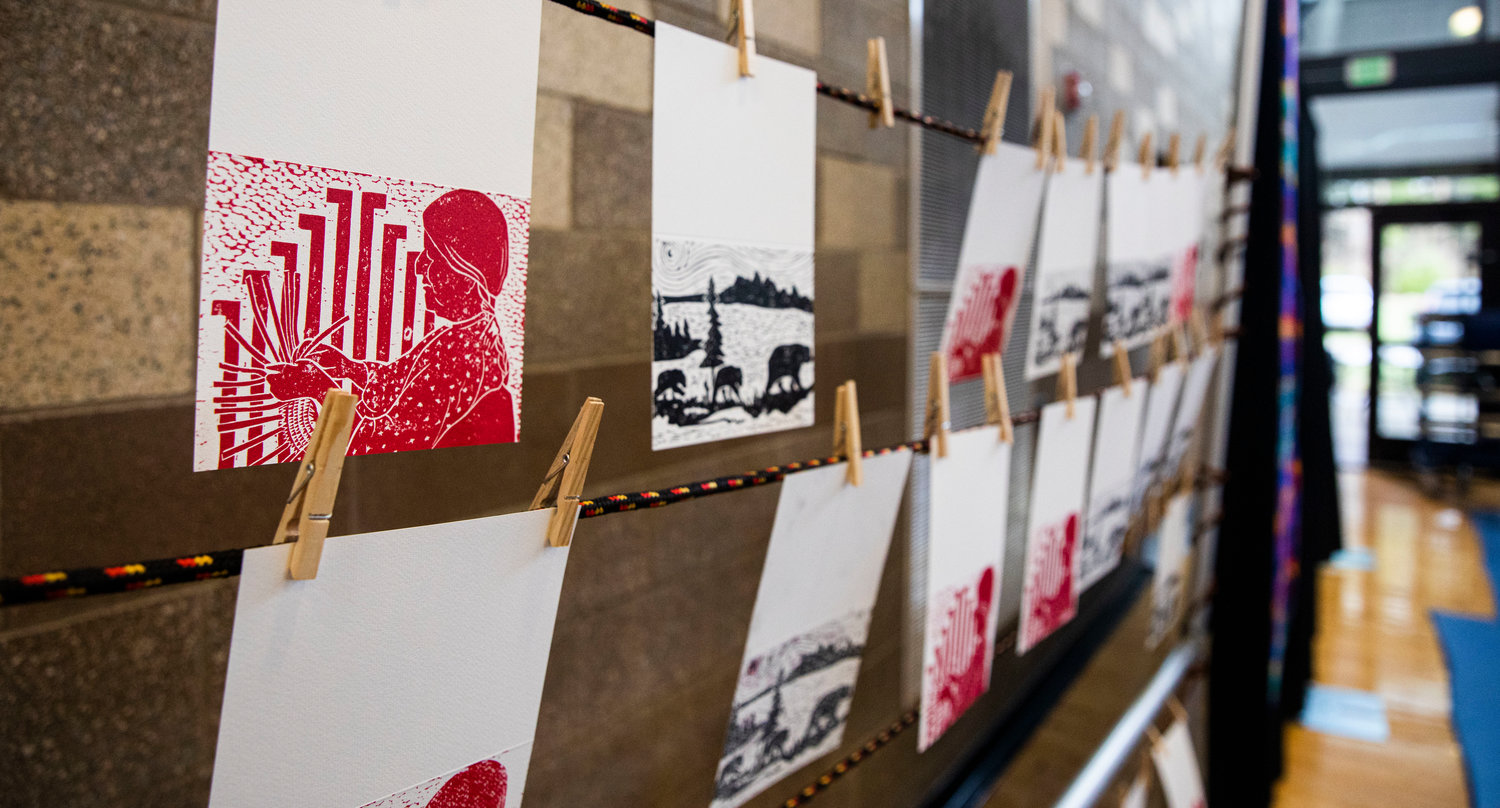 Stamp art hangs on display during a ceremony honoring the Hazel Pete legacy at the Chehalis Tribe Community Center in Oakville on Saturday.